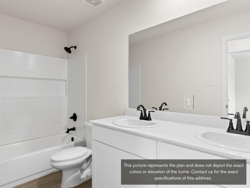 1809 Zelvia Lane Waco, TX 76708 - Photo 20 of 26 a bathroom with a sink a toilet and shower