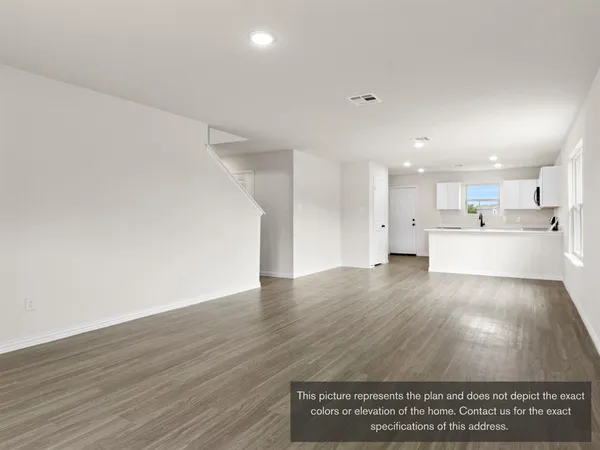 a view of kitchen with wooden floor