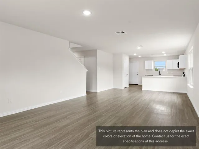 a view of kitchen with wooden floor