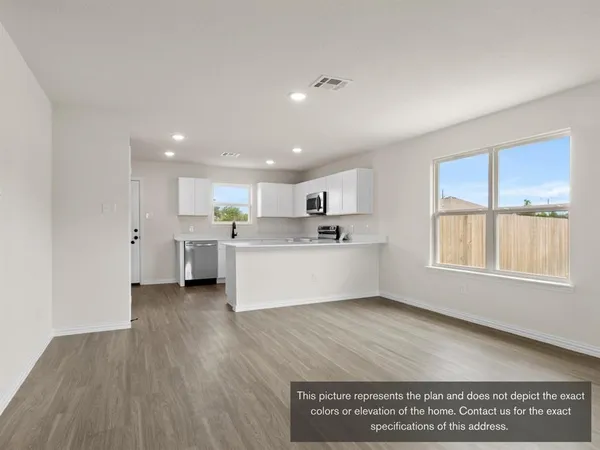 a view of kitchen with wooden floor