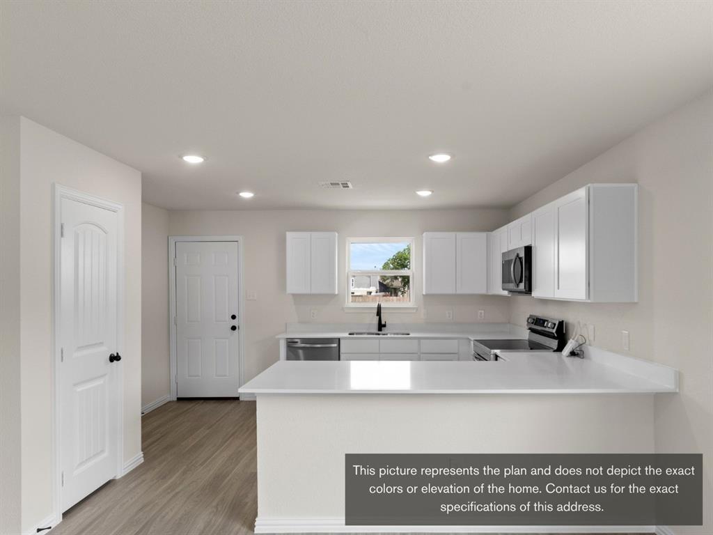 1809 Zelvia Lane Waco, TX 76708 - Photo 9 of 26 a view of kitchen with wooden floor