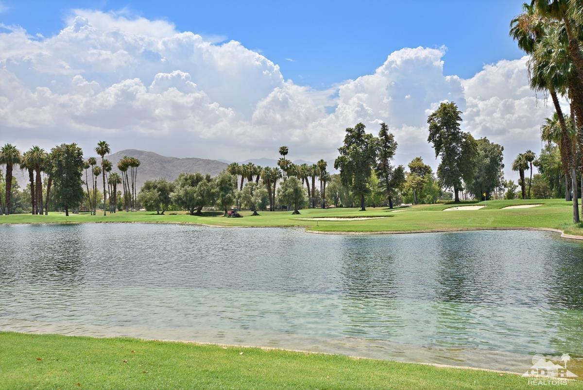900 Island Drive, Unit 109 Rancho Mirage, CA 92270 - Photo 17 of 19 a view of a golf course with a lake