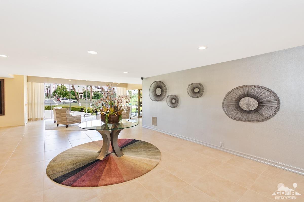 900 Island Drive, Unit 109 Rancho Mirage, CA 92270 - Photo 18 of 19 a view of a living room and kitchen