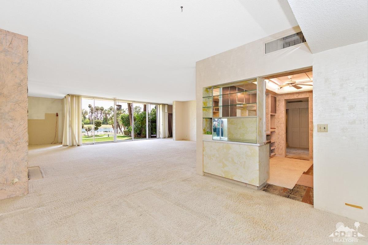 900 Island Drive, Unit 109 Rancho Mirage, CA 92270 - Photo 8 of 19 a view of an empty room with a window