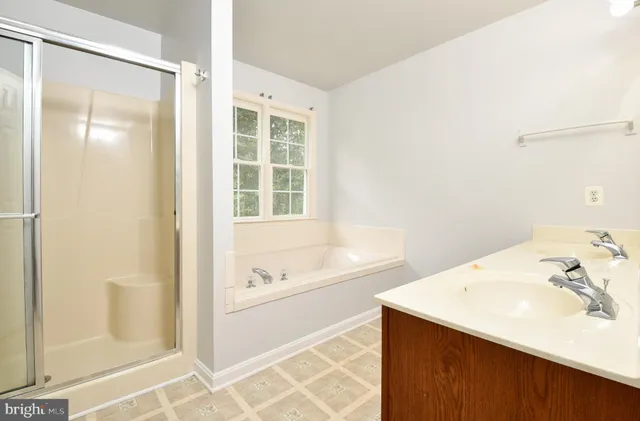 a bathroom with a bathtub and a sink