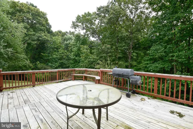a balcony with a table and chairs