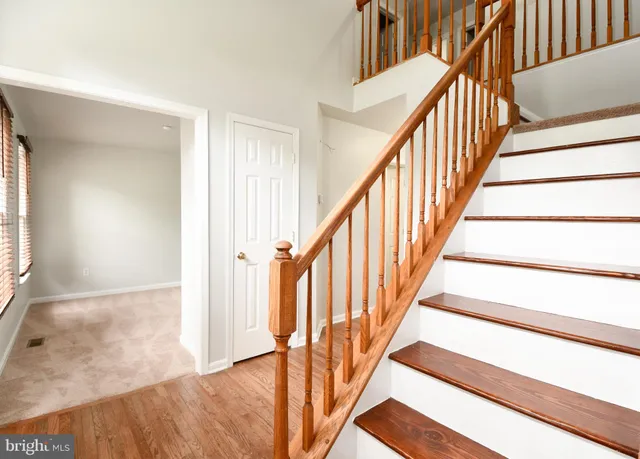 a view of an entryway with wooden floor