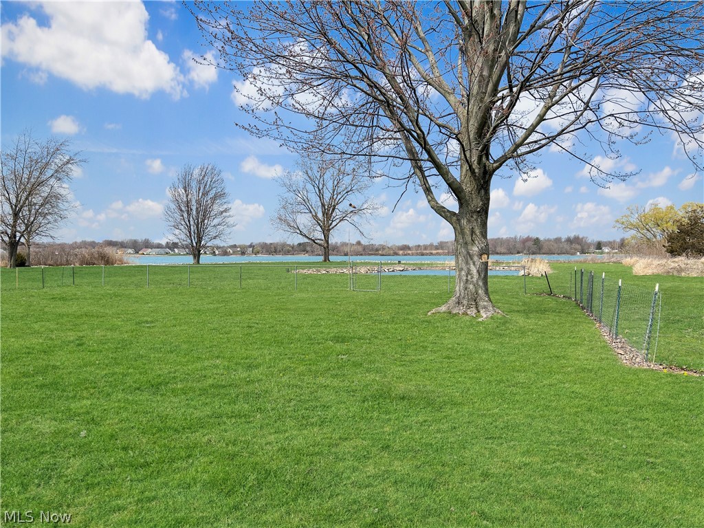 4663 East Harbor Road Port Clinton, OH 43452 - Photo 29 of 31 View of yard featuring a rural view and a water view