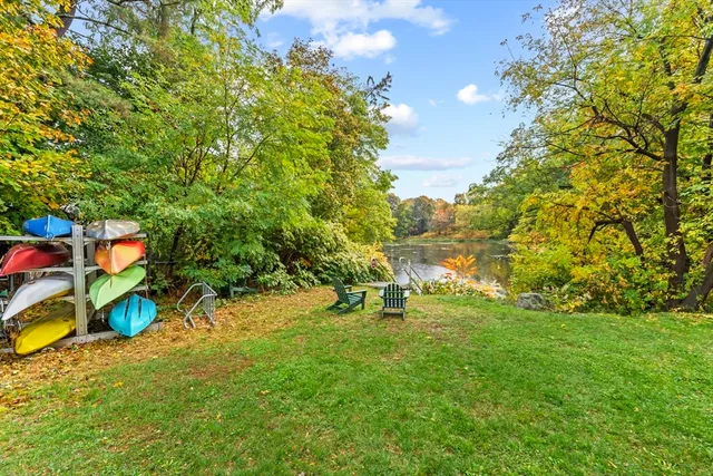 a backyard of a house with yard and outdoor seating
