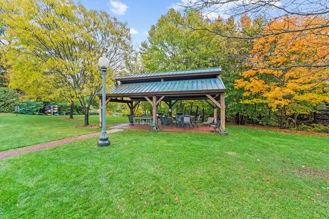 a view of backyard with deck and garden