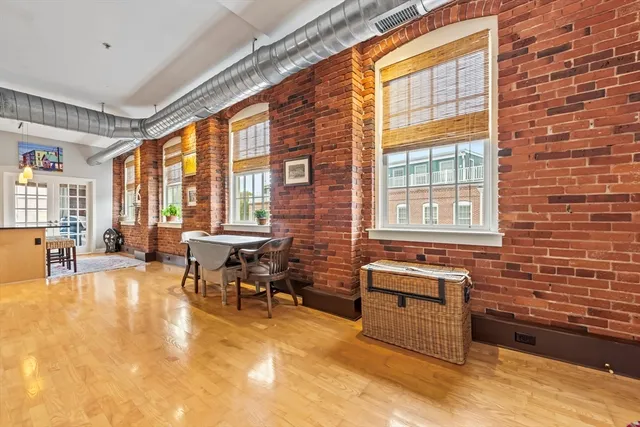 a living room filled with furniture window and a table
