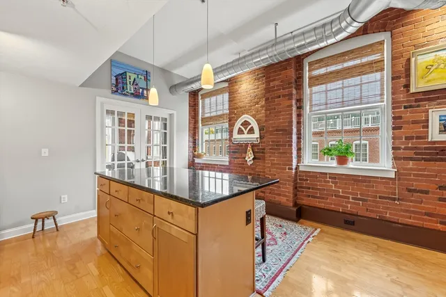 a view of kitchen with furniture and large window