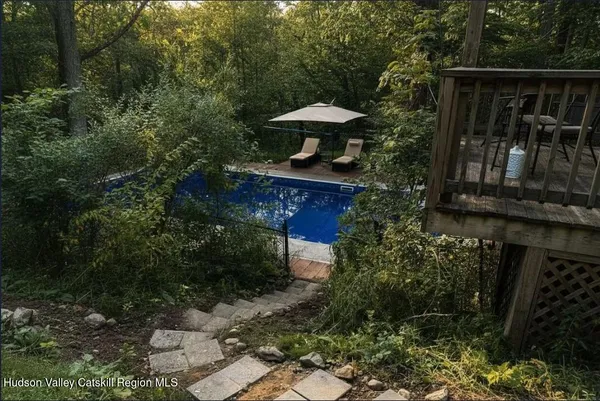 a view of a wooden door with a bench