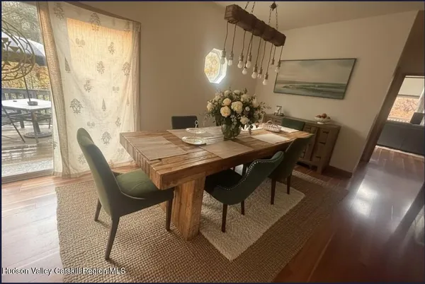 a bedroom with a bed table and window