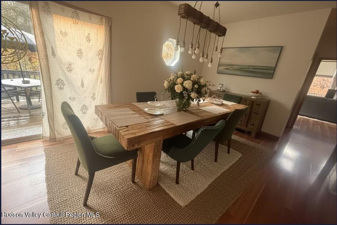 614 Salls Road New Lebanon, NY 12029 - Photo 8 of 22 a view of a dining room with furniture window and wooden floor