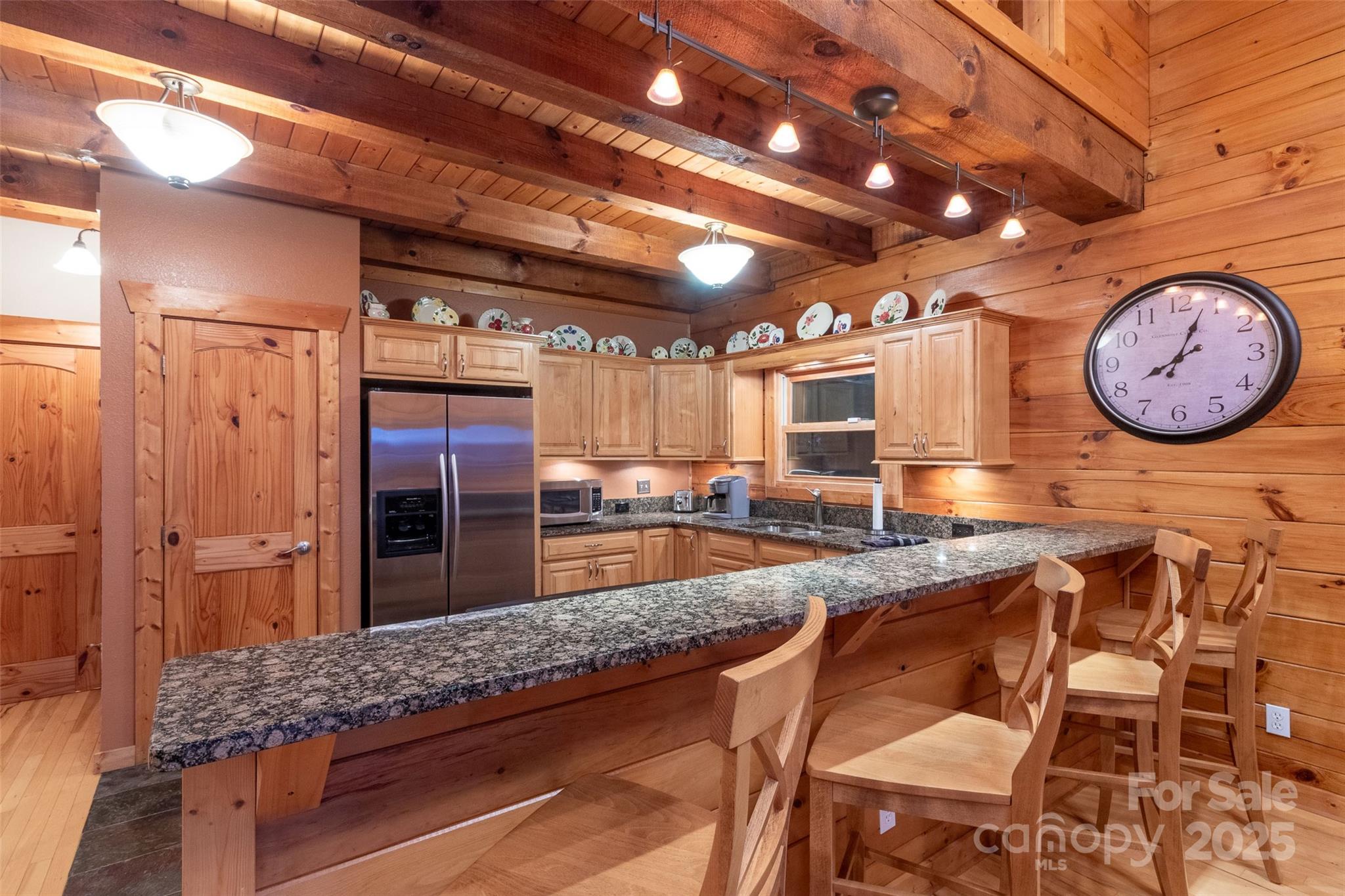 776 Still Branch Road Sylva, NC 28779 - Photo 16 of 43 a large kitchen with a table and chairs