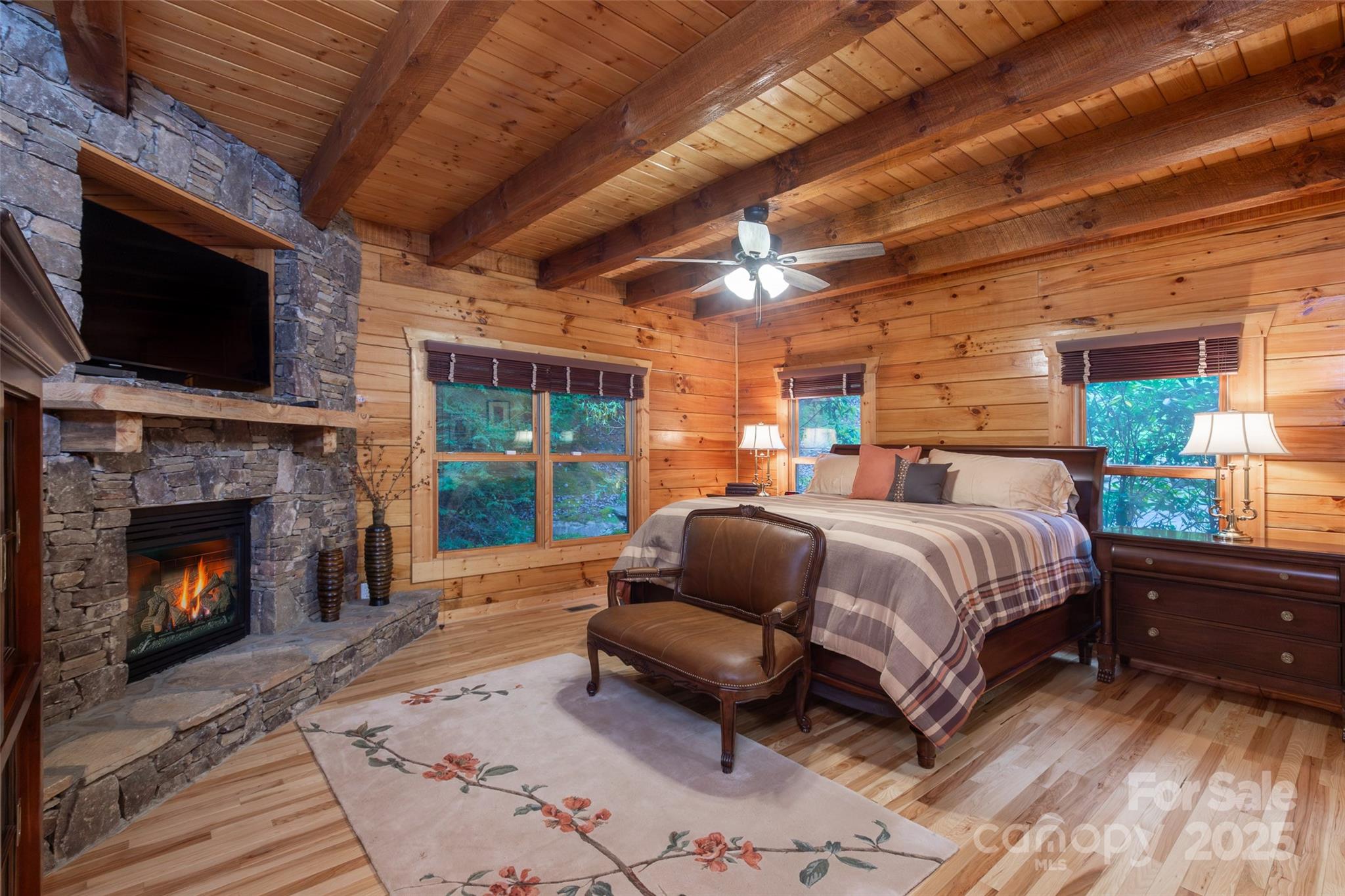 776 Still Branch Road Sylva, NC 28779 - Photo 19 of 43 a bedroom with a bed a flat screen tv and balcony view