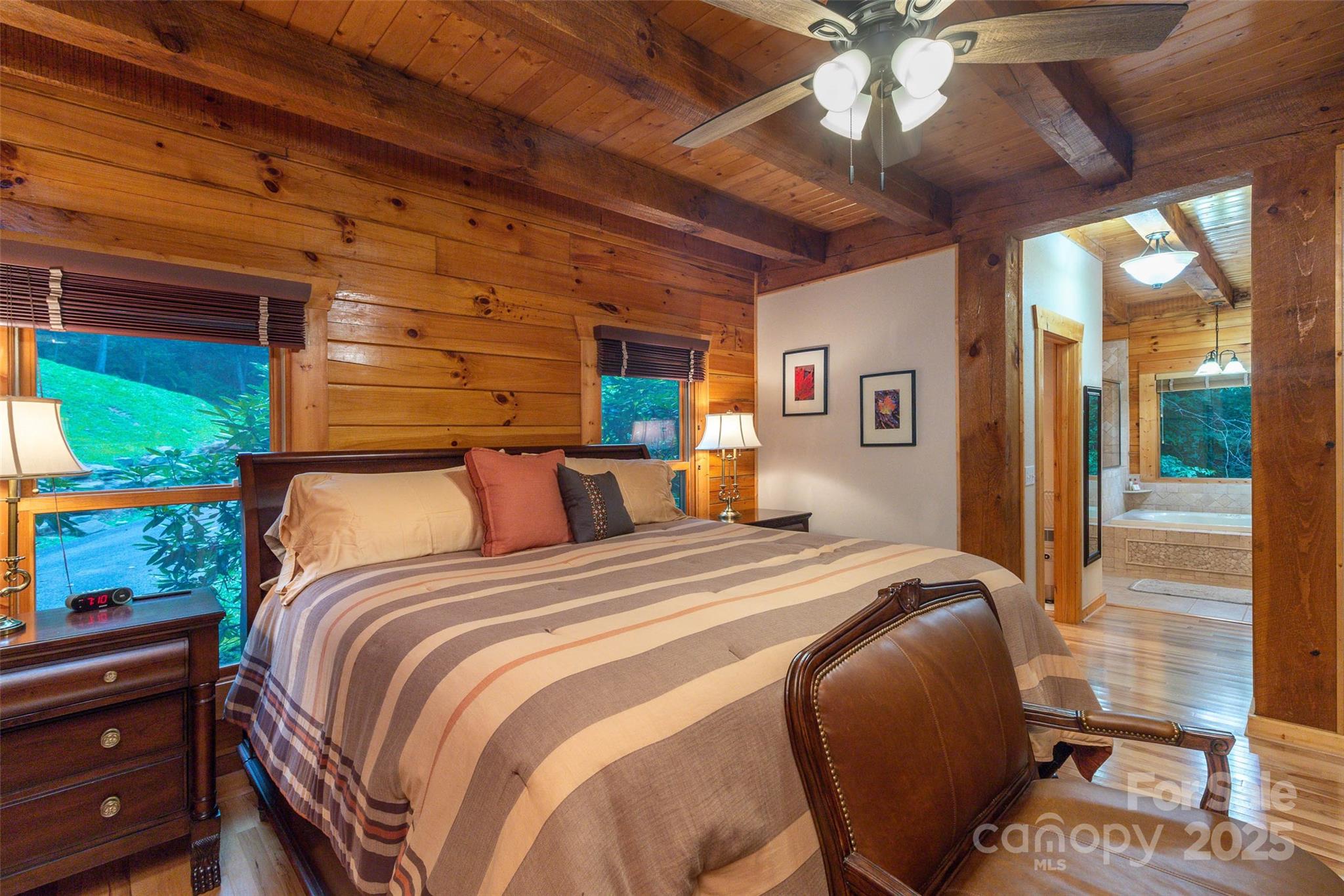 776 Still Branch Road Sylva, NC 28779 - Photo 20 of 43 a bed sitting in a bedroom next to a window