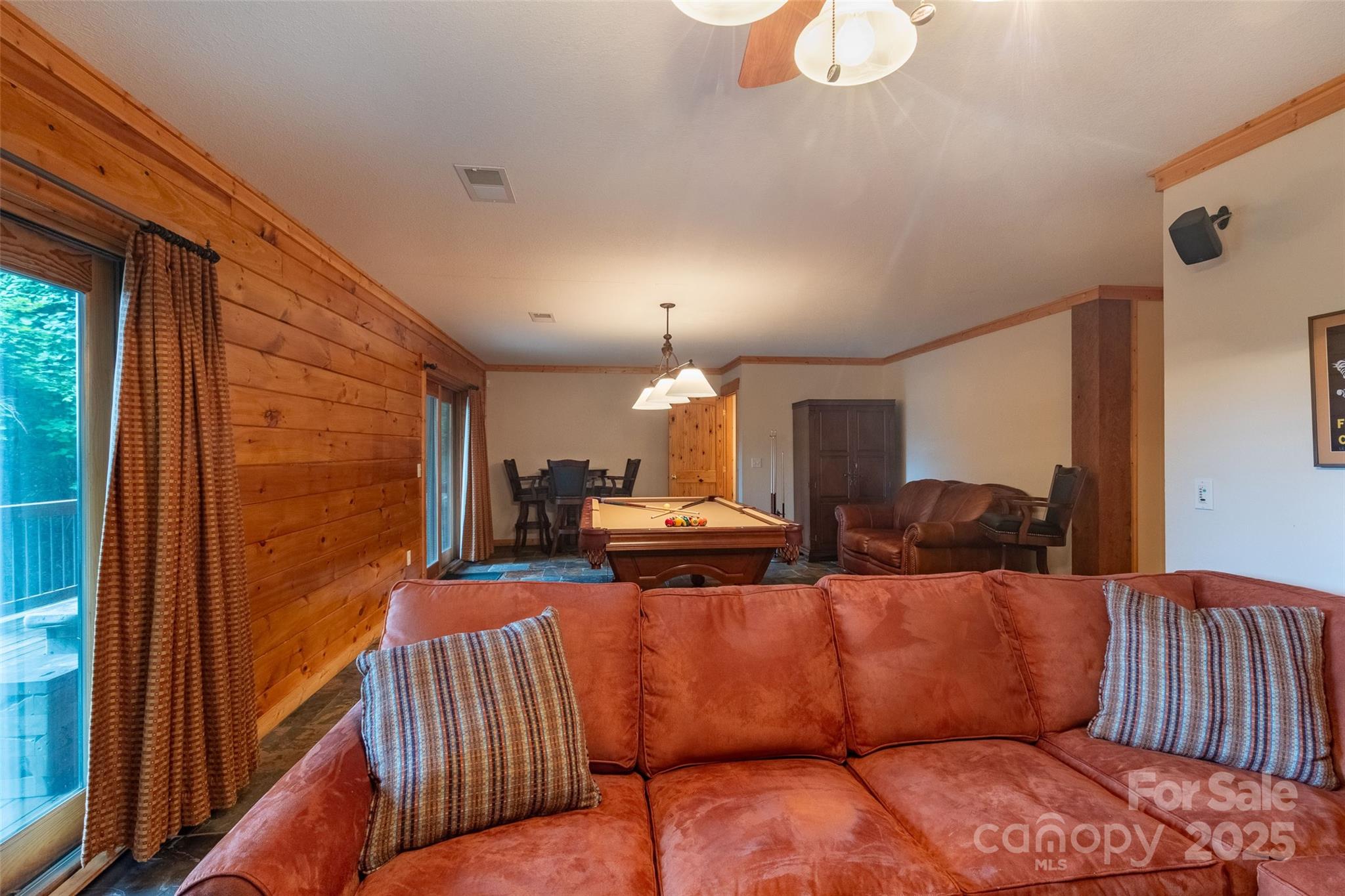 776 Still Branch Road Sylva, NC 28779 - Photo 27 of 43 a living room with furniture fireplace and a window