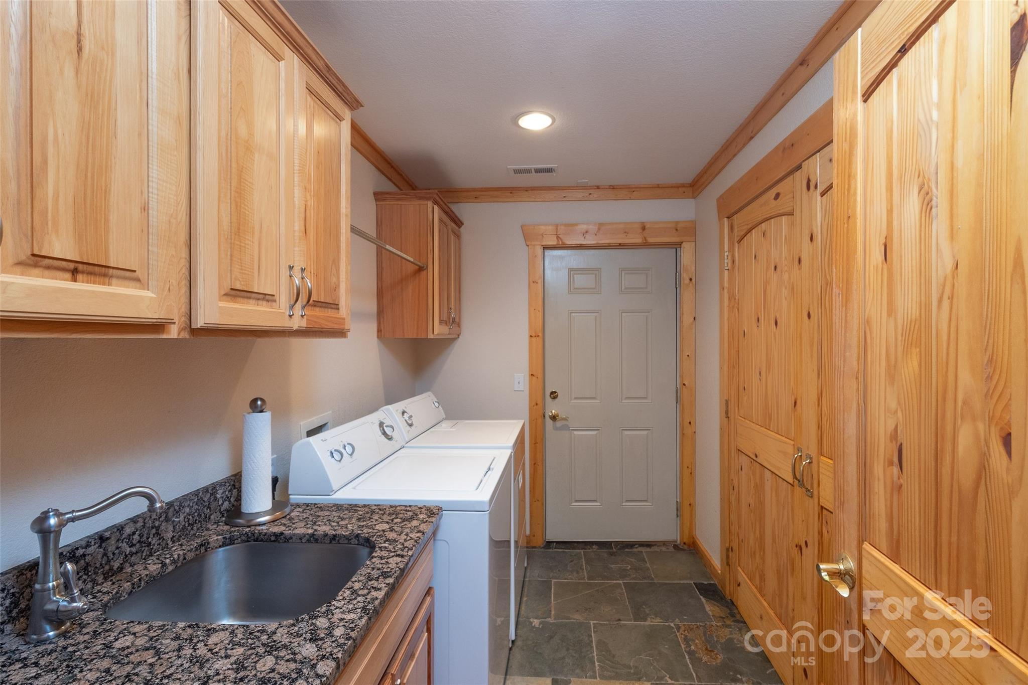 776 Still Branch Road Sylva, NC 28779 - Photo 30 of 43 a kitchen with a sink a refrigerator and a window