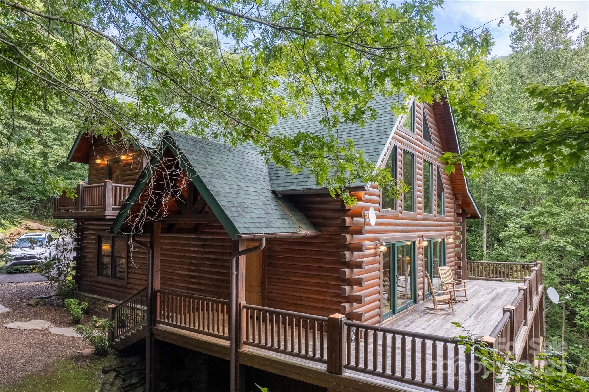 776 Still Branch Road Sylva, NC 28779 - Photo 8 of 43 a front view of a house with a garden