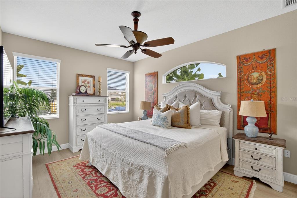 306 Hope Bay Loop Apollo Beach, FL 33572 - Photo 19 of 53 a bedroom with a bed and a window