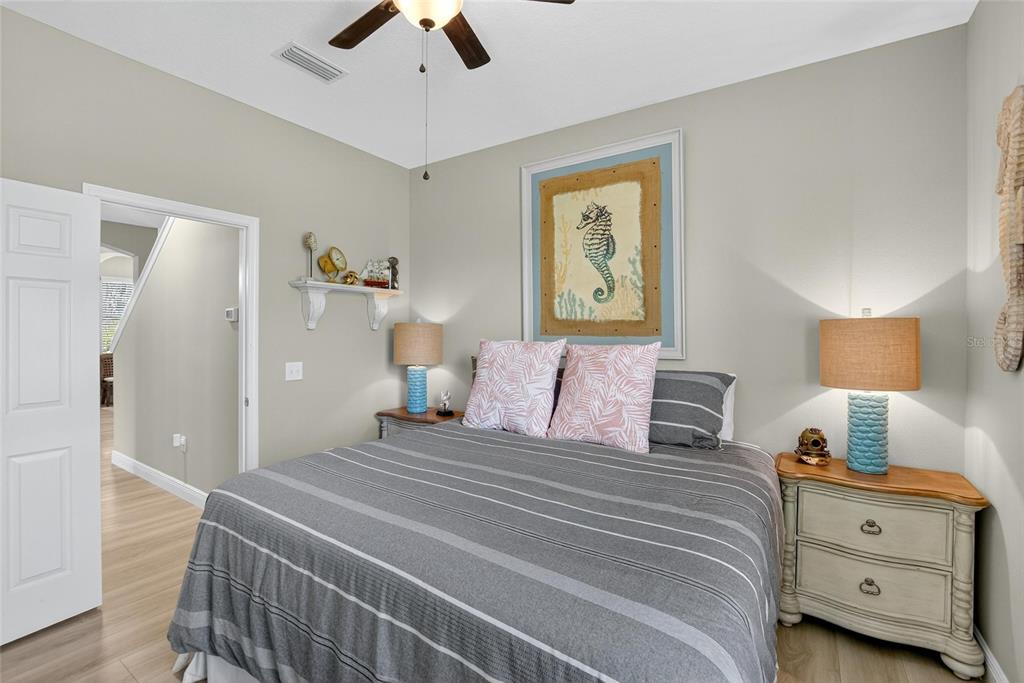 306 Hope Bay Loop Apollo Beach, FL 33572 - Photo 25 of 53 a bedroom with a bed and a night stand