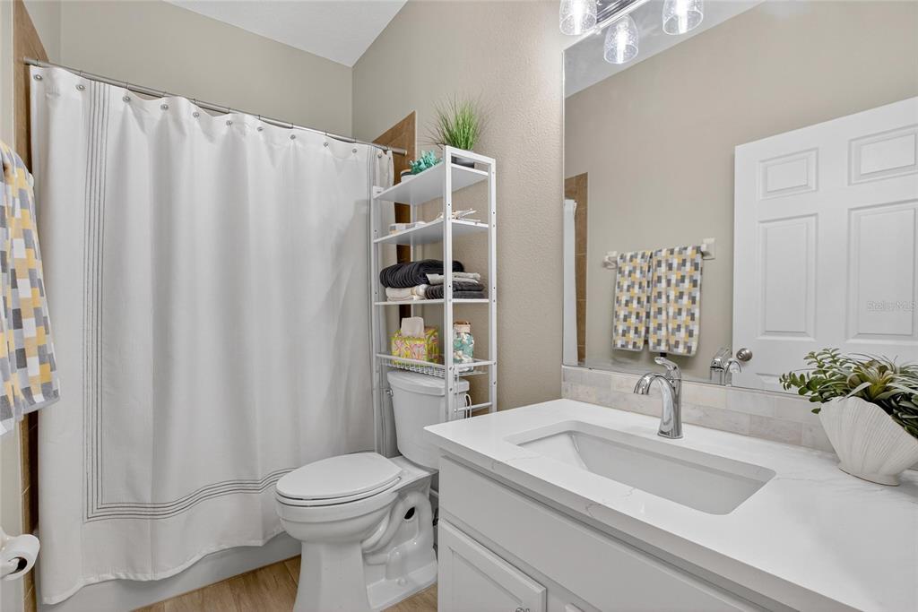 306 Hope Bay Loop Apollo Beach, FL 33572 - Photo 26 of 53 a bathroom with a sink toilet and shower