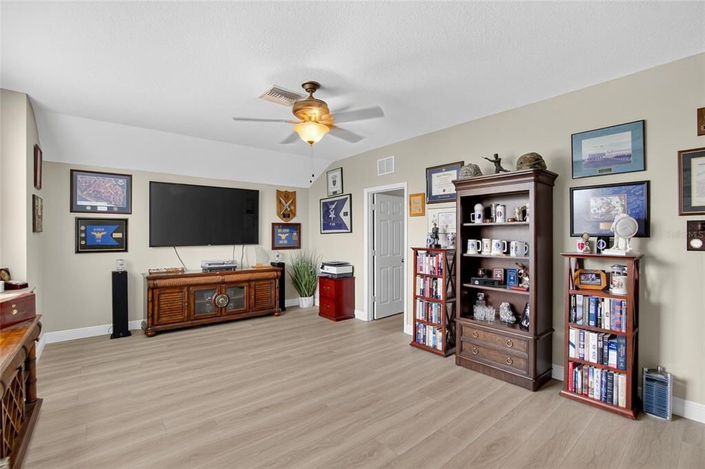 306 Hope Bay Loop Apollo Beach, FL 33572 - Photo 30 of 53 a view of a livingroom with furniture and wooden floor