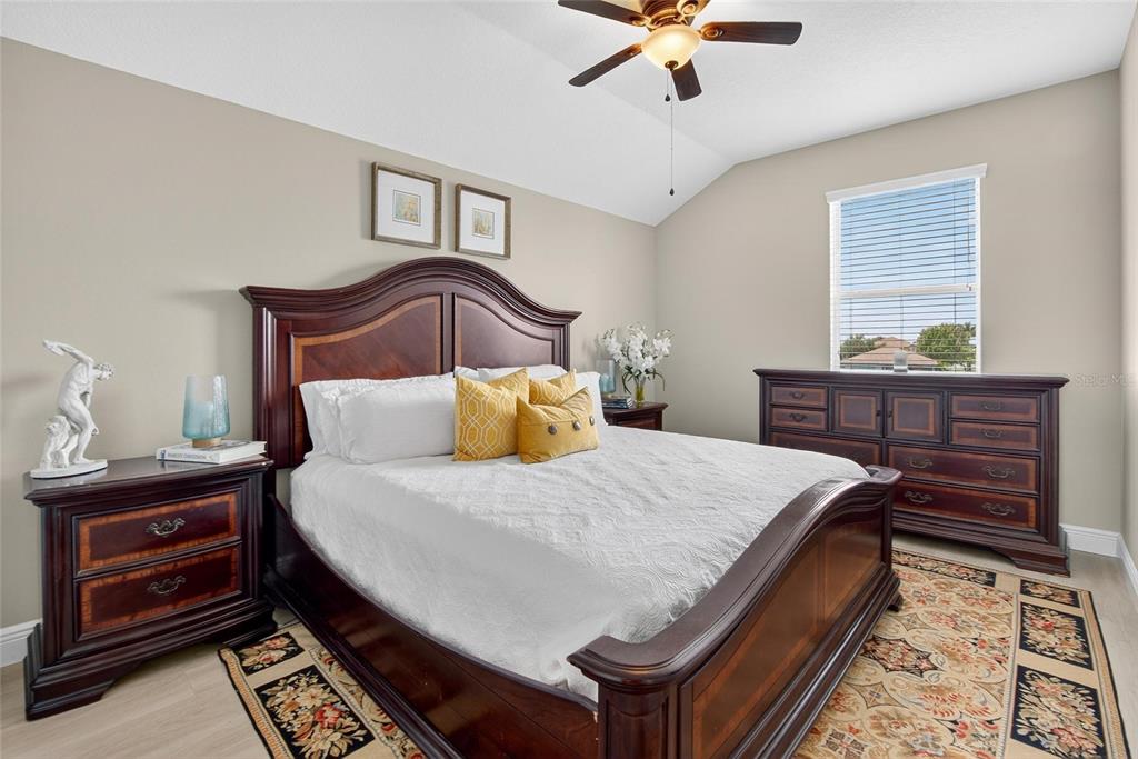 306 Hope Bay Loop Apollo Beach, FL 33572 - Photo 33 of 53 a bedroom with a bed and a dresser