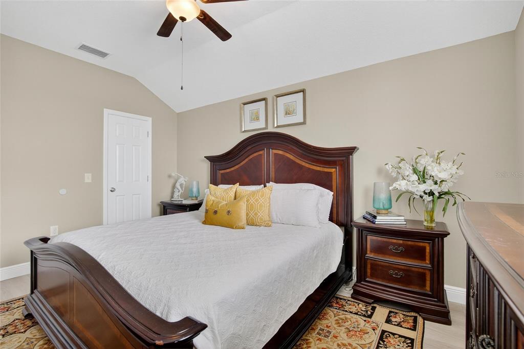 306 Hope Bay Loop Apollo Beach, FL 33572 - Photo 34 of 53 a bedroom with a bed and ceiling fan