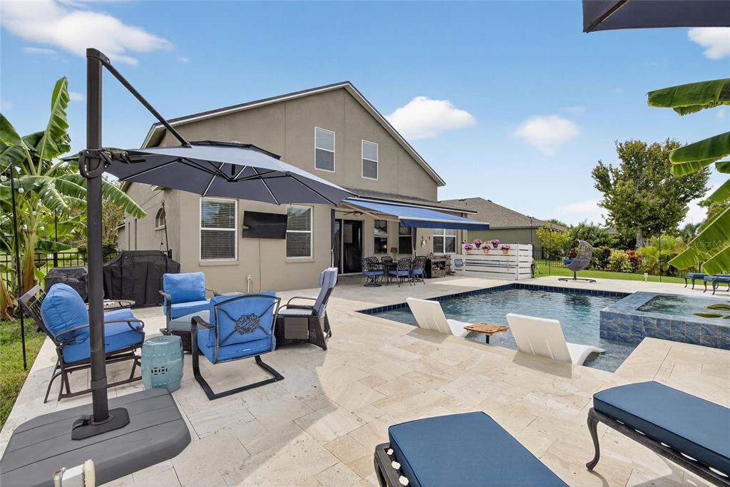 306 Hope Bay Loop Apollo Beach, FL 33572 - Photo 40 of 53 a view of house with swimming pool outdoor seating and living room