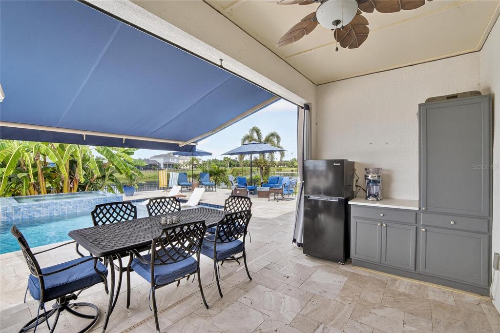 306 Hope Bay Loop Apollo Beach, FL 33572 - Photo 41 of 53 a view of a dining room with furniture window and outside view