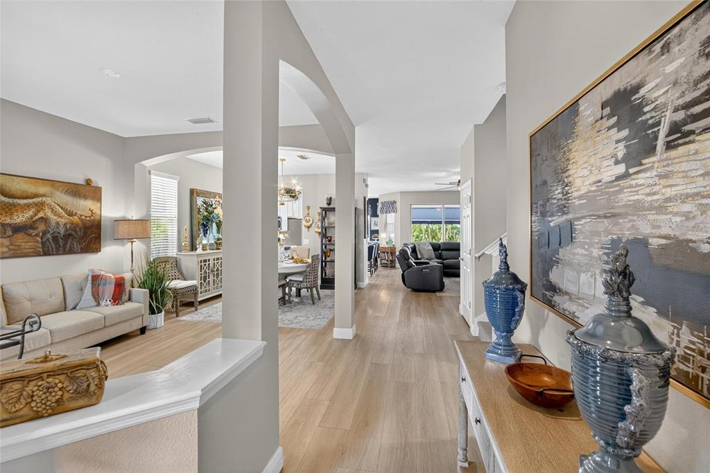 306 Hope Bay Loop Apollo Beach, FL 33572 - Photo 8 of 53 a living room with furniture and wooden floor