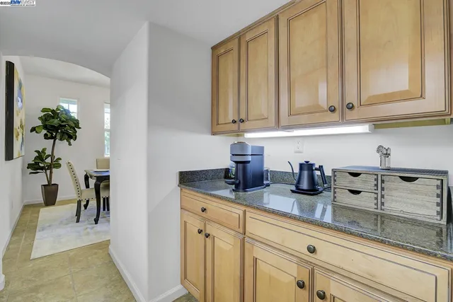 a kitchen with cabinets and window