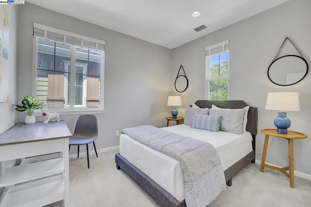 a bedroom with bed and a window