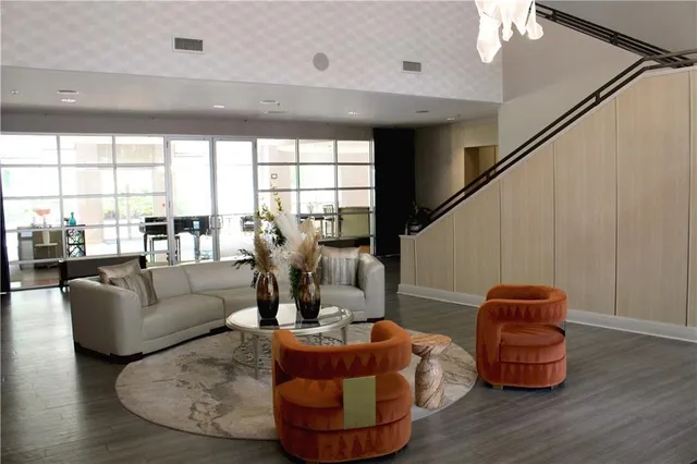 a living room with furniture and a large window