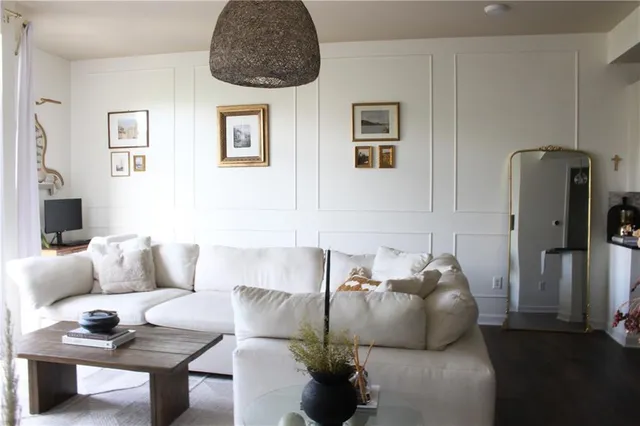 a living room with furniture and a rug