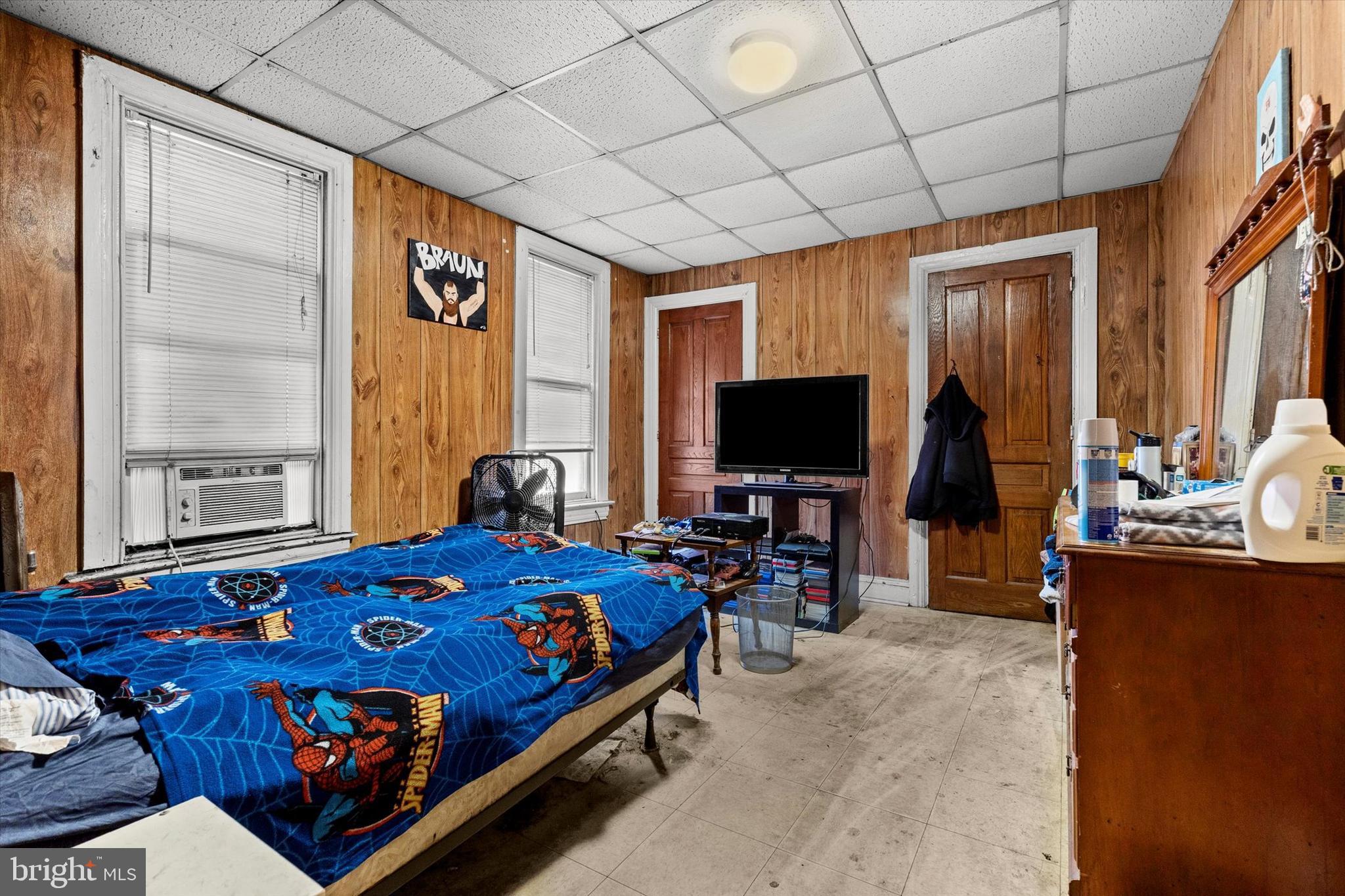 23 South West Street York, PA 17401 - Photo 14 of 39 a bedroom with bed and a flat tv screen next to a window