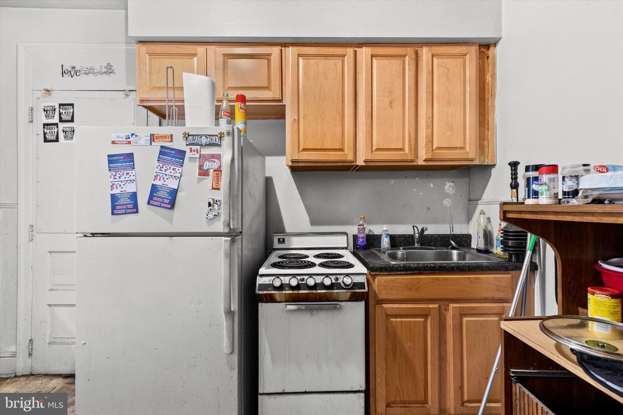 23 South West Street York, PA 17401 - Photo 16 of 39 a kitchen with a refrigerator and a stove top oven