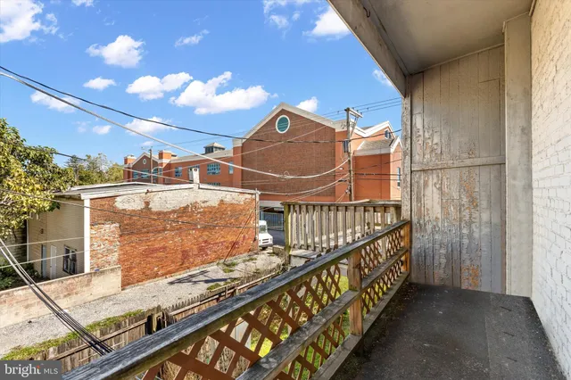 a view of balcony with furniture