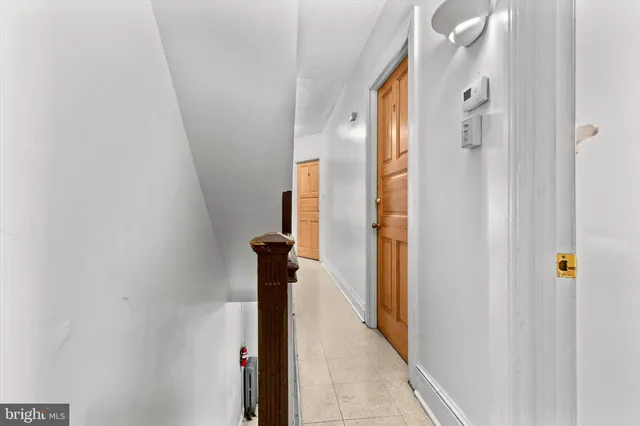 a view of a hallway with a shower