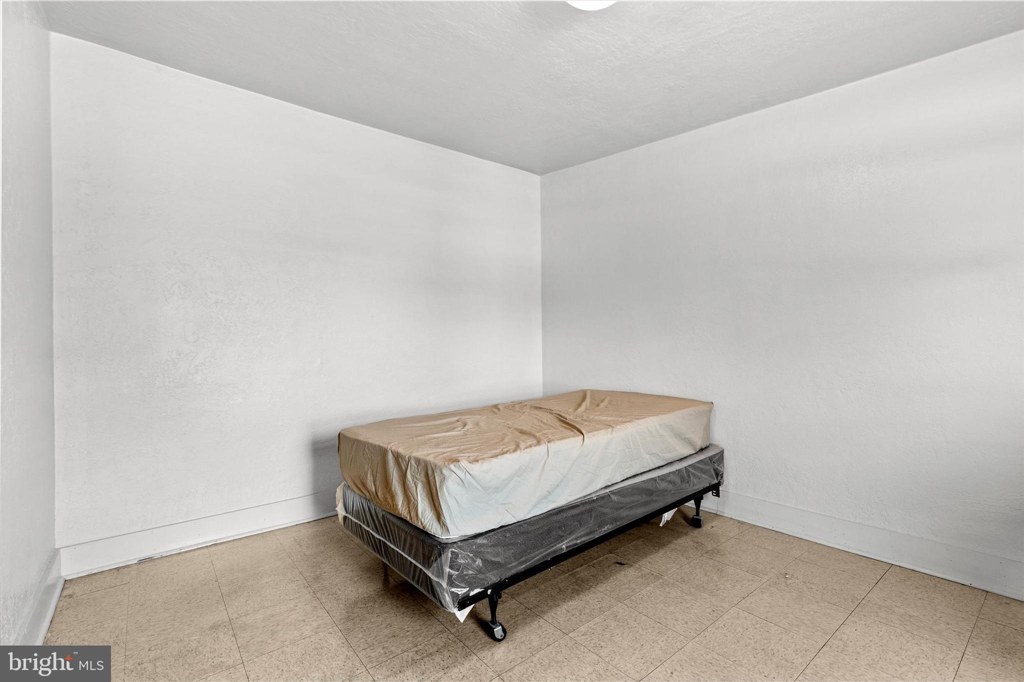 23 South West Street York, PA 17401 - Photo 28 of 39 a room with a bed and a table