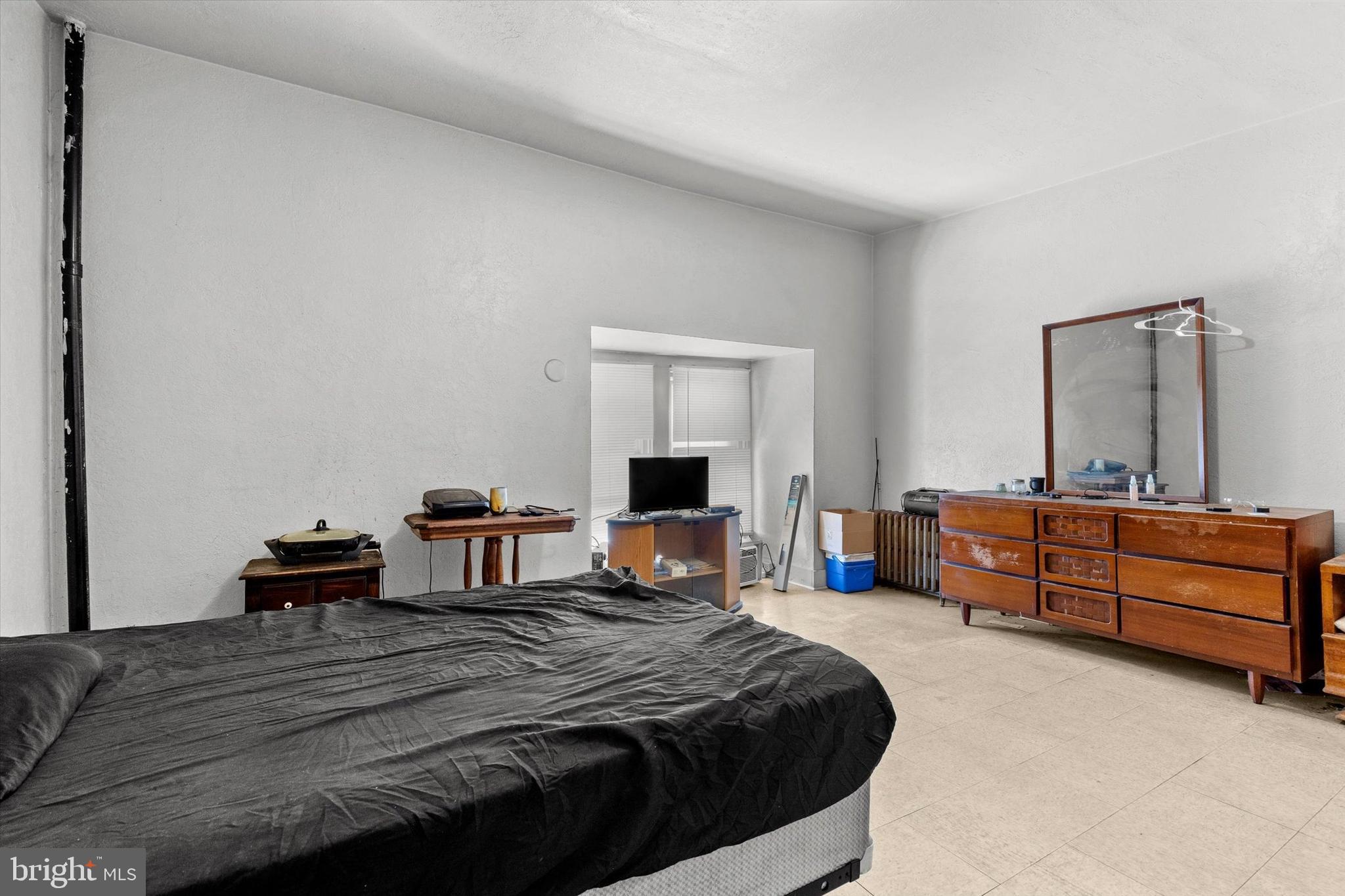 23 South West Street York, PA 17401 - Photo 31 of 39 a bedroom with a bed and a mirror on dresser