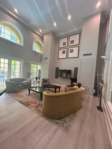 a lobby with furniture and a ceiling fan