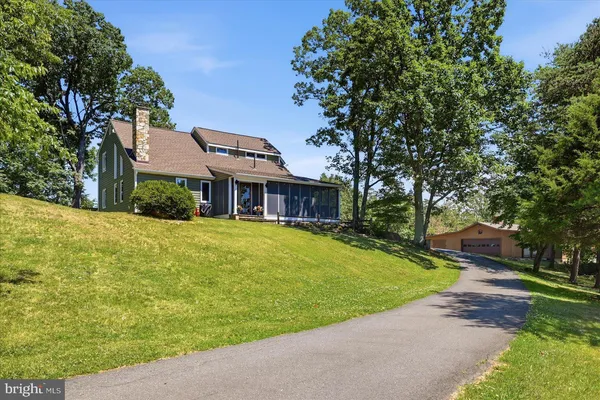 a view of a pathway with a yard
