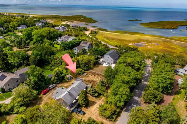 an aerial view of residential houses with outdoor space