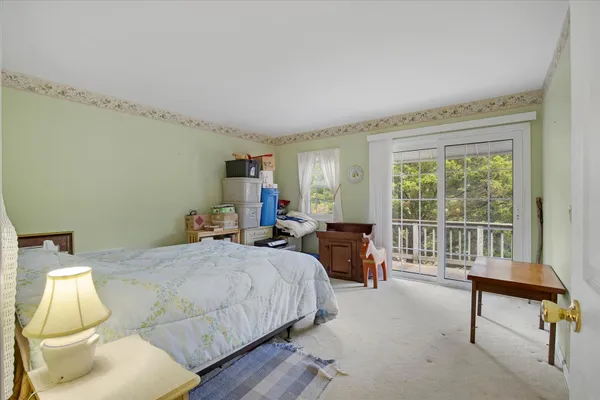 a spacious bedroom with a bed and a couch