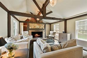 490 Bear Ridge Road Pleasantville, NY 10570 - Photo 1 of 1 a living room with furniture a fireplace and a large window