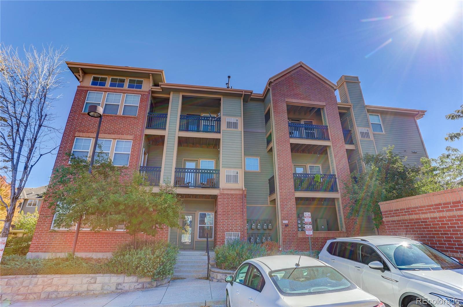 9633 East 5th Avenue, Unit 10208 Denver, CO 80230 - Photo 19 of 47 a front view of a building with parking space